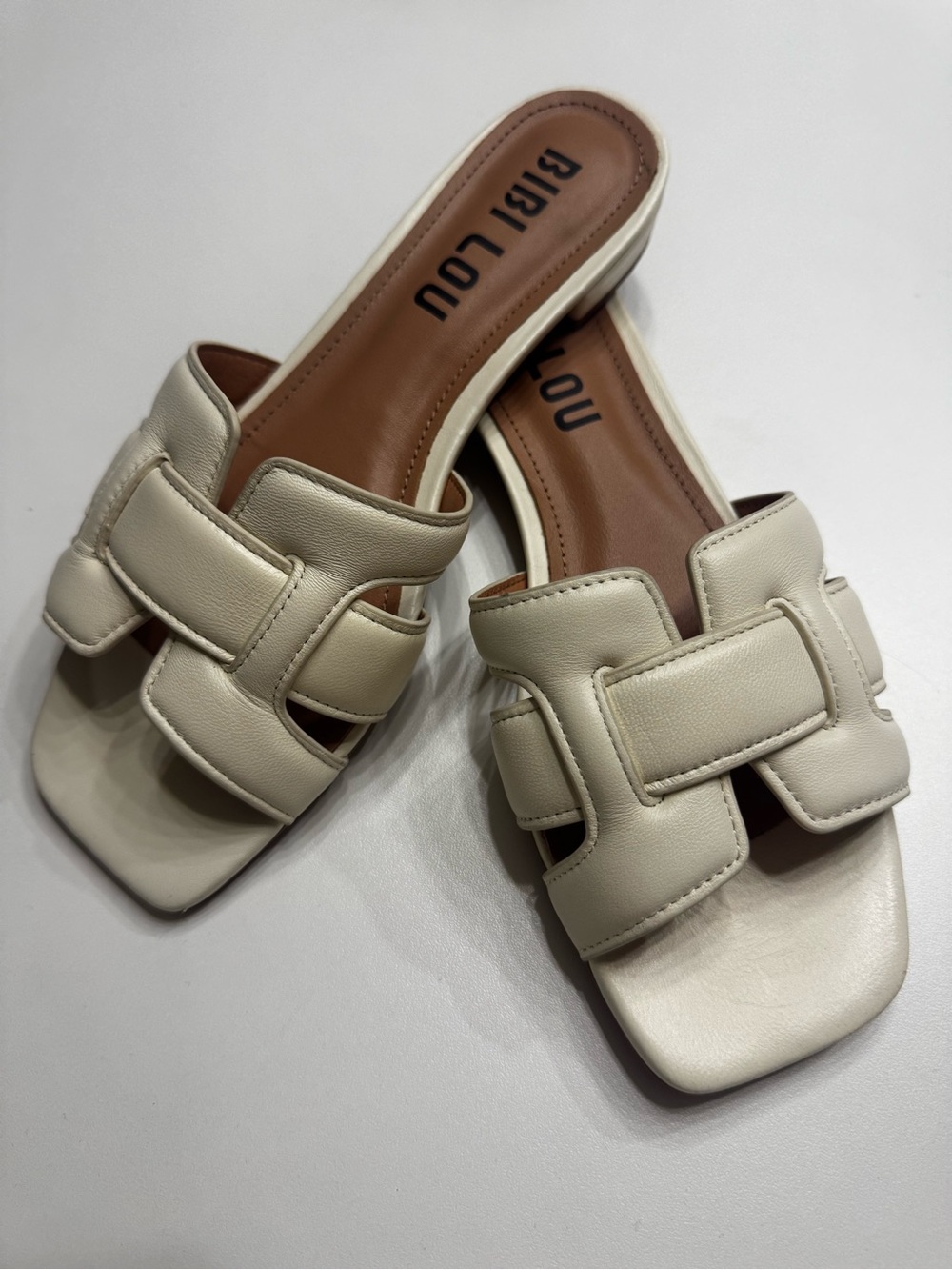 Biri Lou Cream Slide Sandals with Interlock Strap
